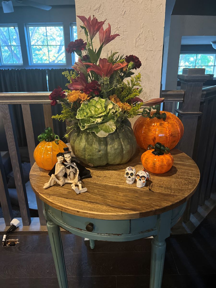 Autumn arrangement in a carved pumpkin vase
