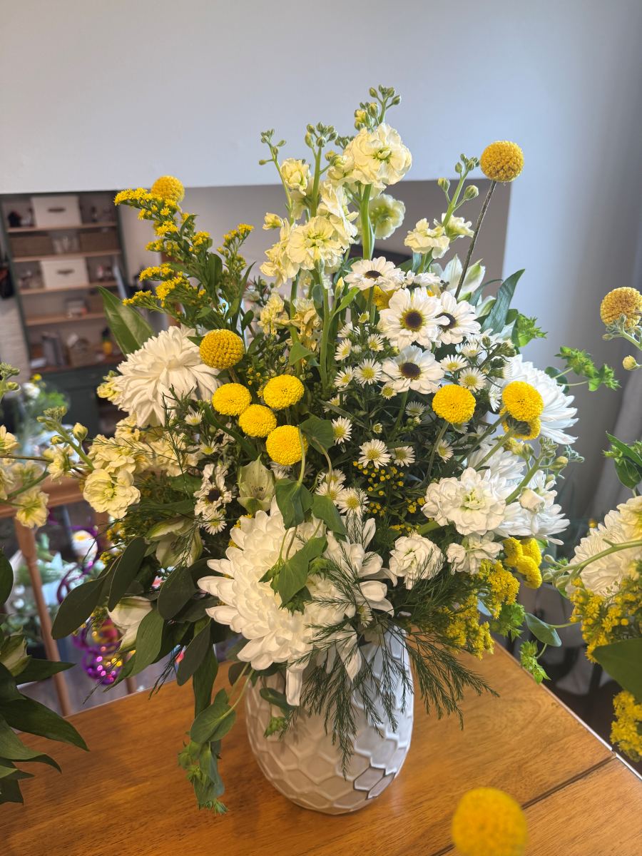 White chrysanthemum and billy-ball arrangement