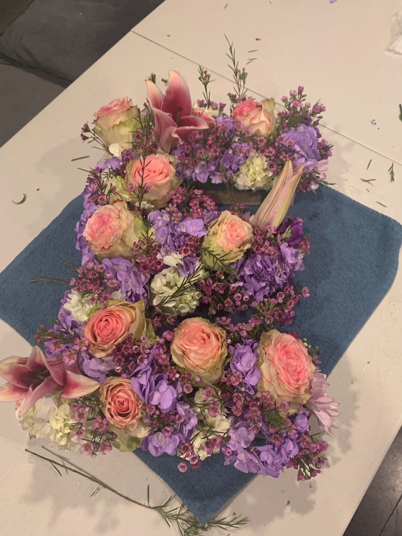A cluster of petite pink and lavender arrangements