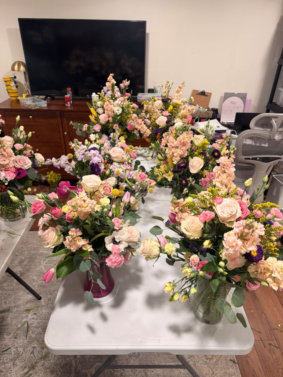 A spread of blush and pink arrangements ready for an event